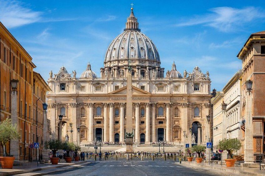 A grand historical building with a large dome and columns, surrounded by other classical architecture. 2