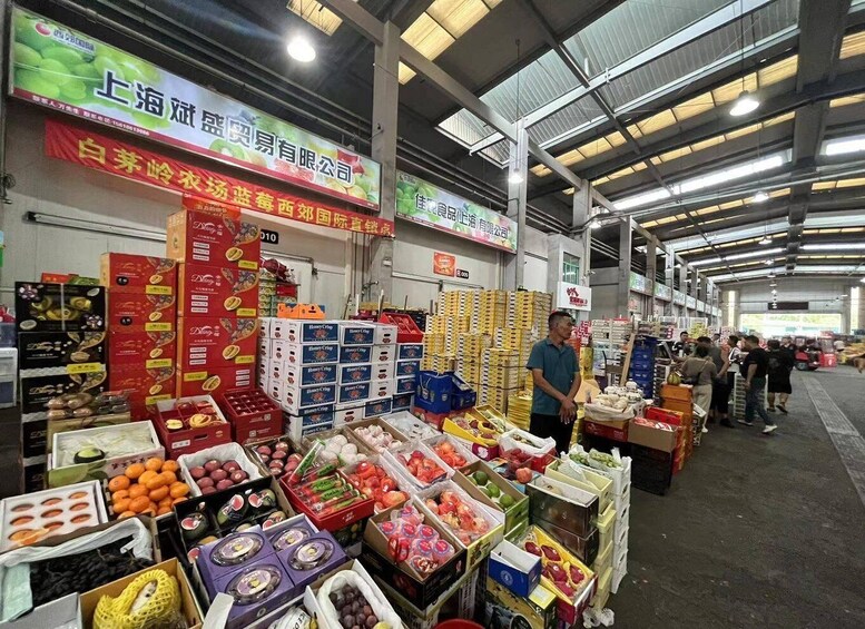 A market with various food items and boxes of honeycrisp apples. 5