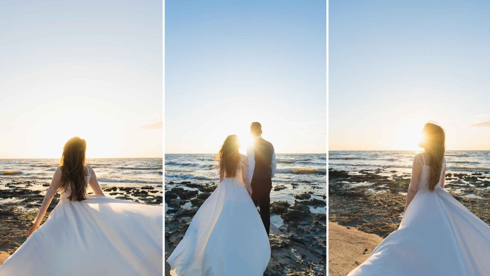 A bride and groom standing on a rocky beach at sunset. 1