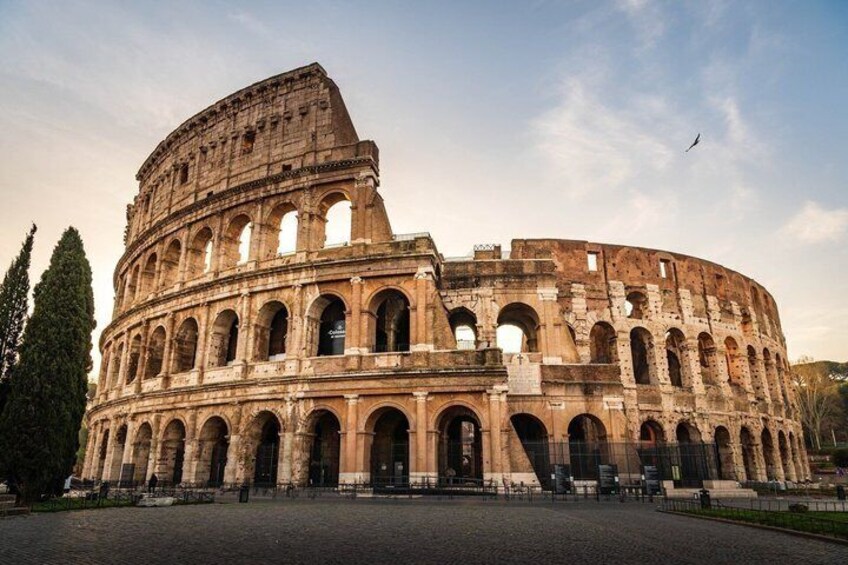 The Colosseum in Rome, Italy, with its iconic arches and ancient stone structure. 5