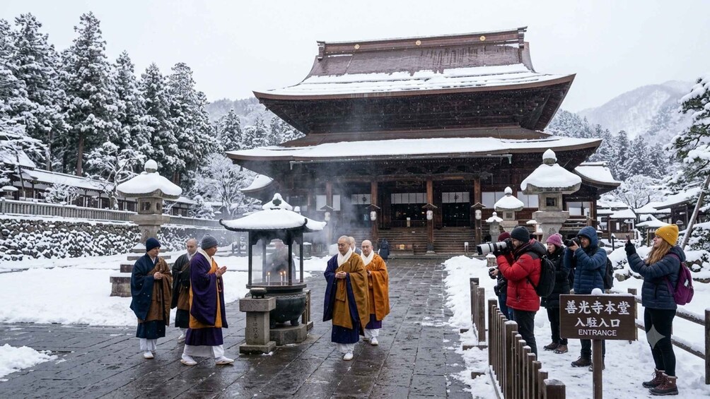 A traditional building with a snow-covered roof, surrounded by snow-laden trees and a stone pathway. 2