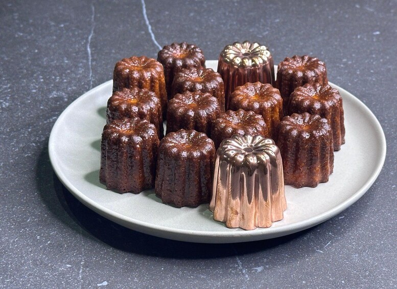 A plate of caramelized desserts with a shiny, decorative top. 3