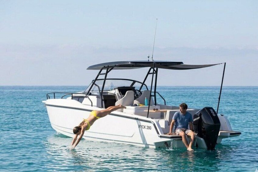 A person diving into the water from a boat. 5