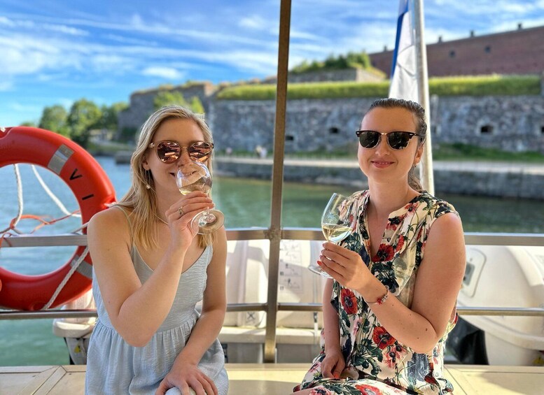 Two people on a boat with a life ring and a castle in the background. 4
