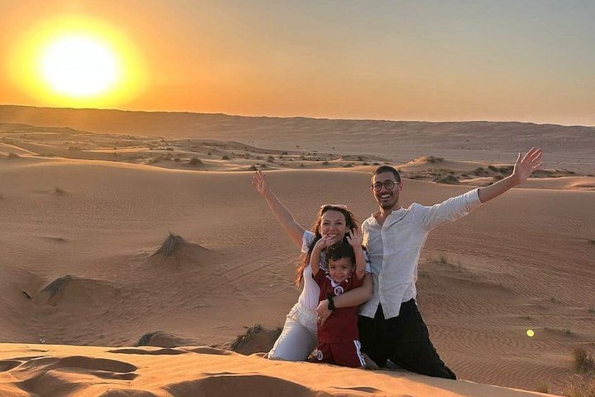 A desert landscape with sand dunes and a sunset. 3