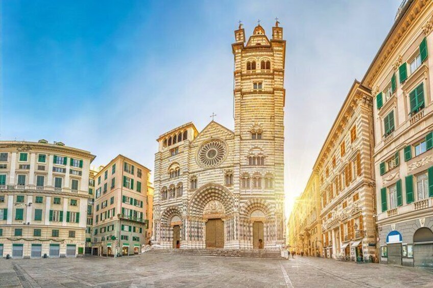 A historic church with a prominent tower and arched windows. 1