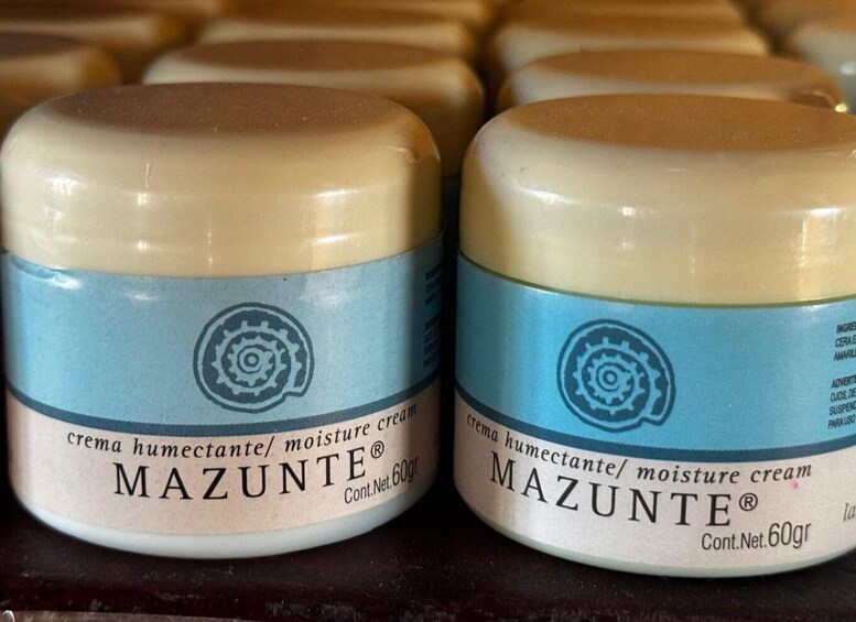 Two containers of Mazunte cream with a blue label and a cream-colored lid. 5