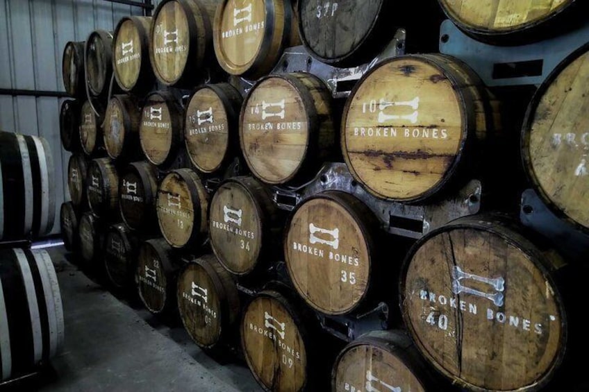 Wooden barrels stacked in a warehouse. 2