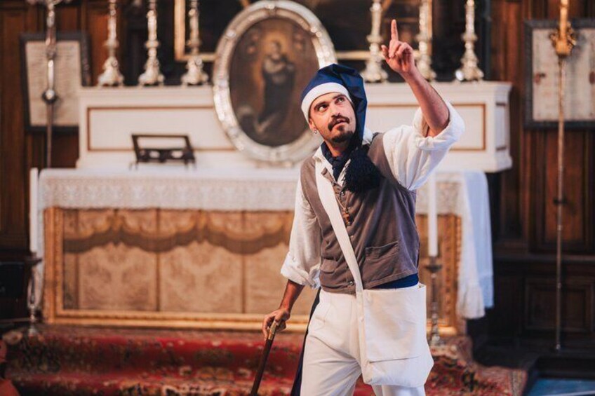 A person in a church setting with a crucifix and religious paintings in the background. 2