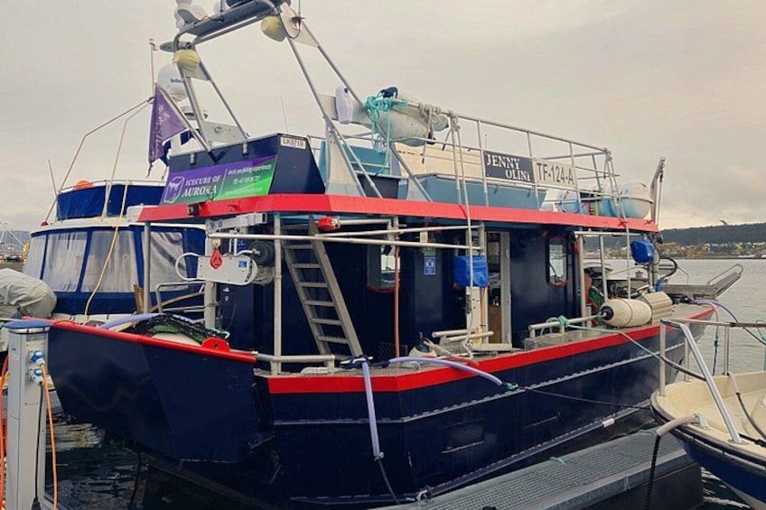 A fishing boat named 'Jenny Gill' docked at a marina. 3