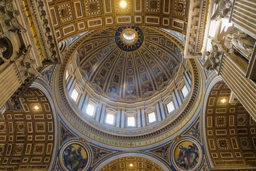 A grand, ornate ceiling with intricate patterns and a central circular design. 4