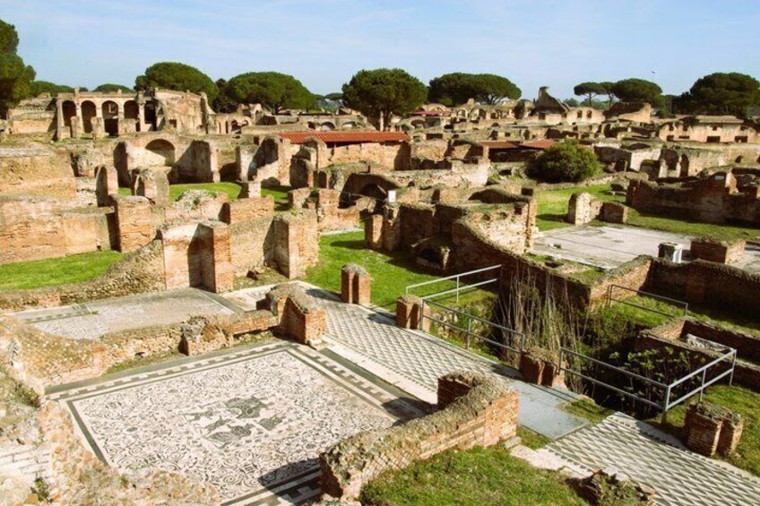 Ancient ruins with stone pathways and arches. 1