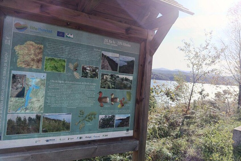 A wooden information board with various ecological and geographical details. 5