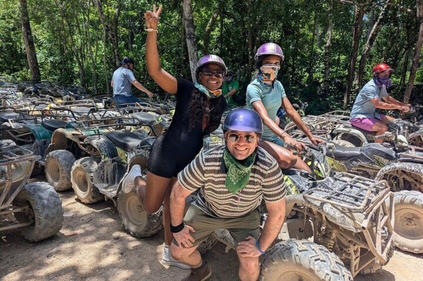People on all-terrain vehicles in a forested area. 5