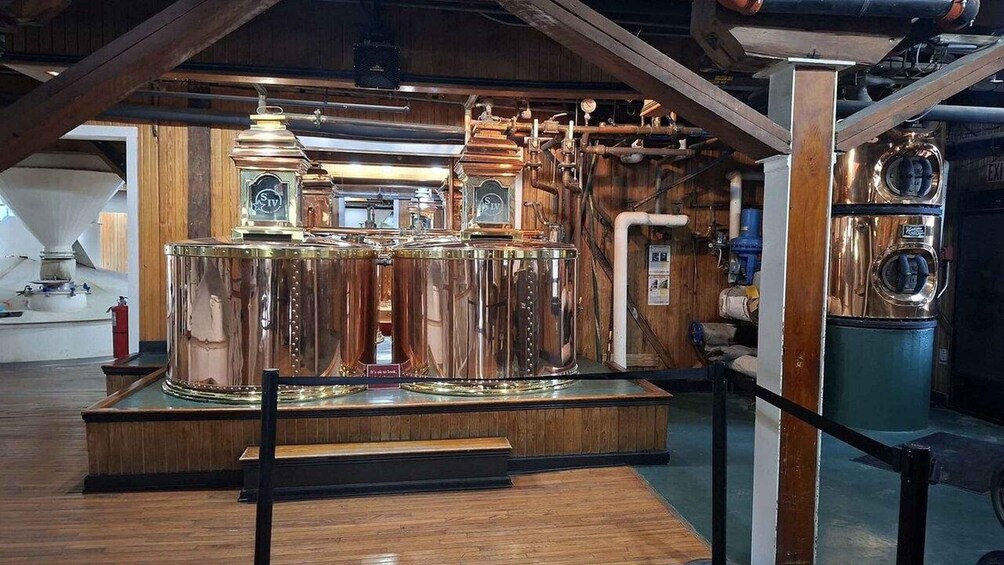 A brass distillation apparatus in a museum setting. 4