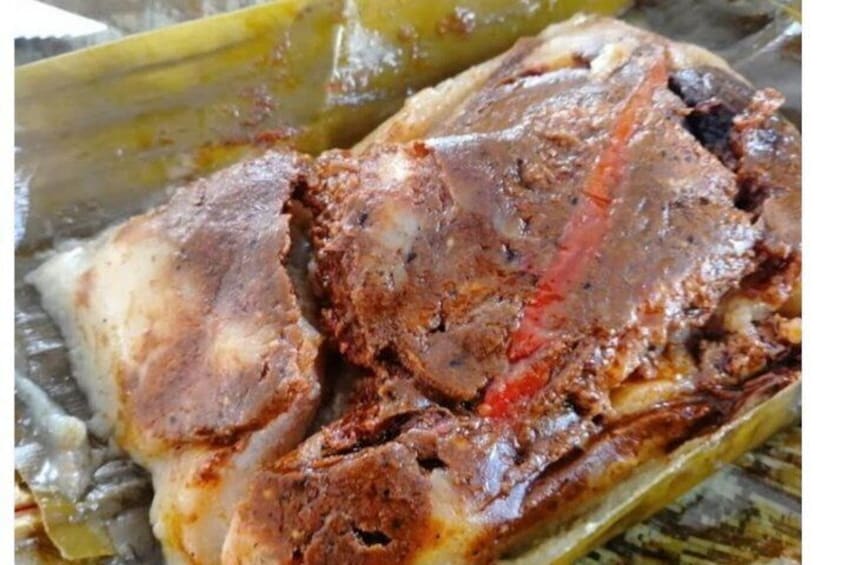 A roasted pig with a crispy skin, served in a traditional clay pot. 4
