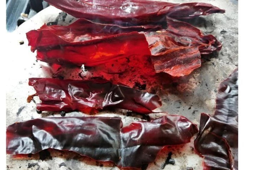 Dried red chili peppers on a surface. 3