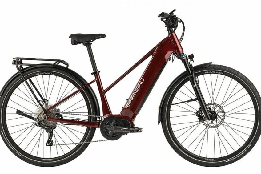 A maroon road bike with a front suspension fork, a rear rack, and a chain guard. 3