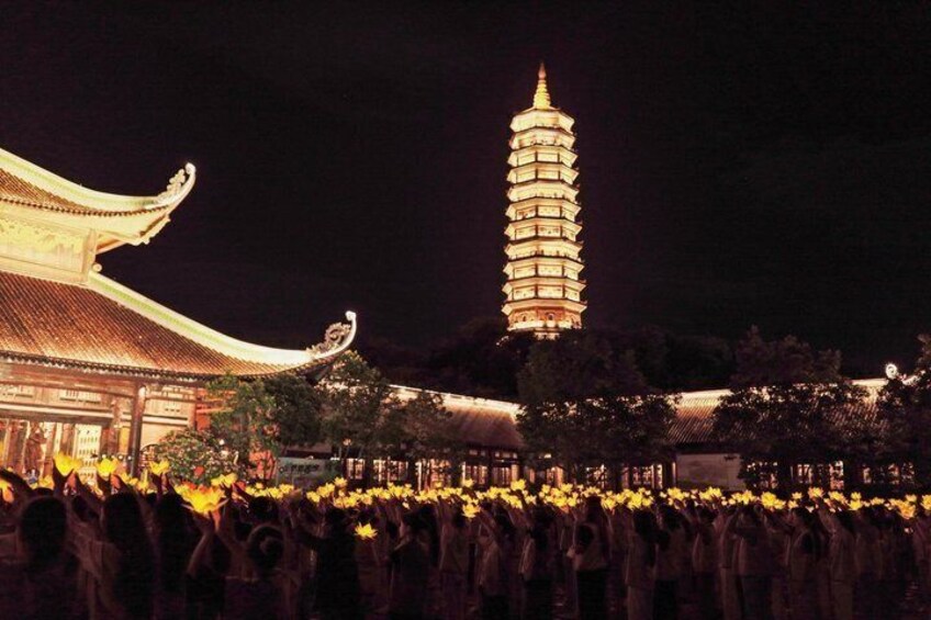 A pagoda with a crowd of people in front. 1