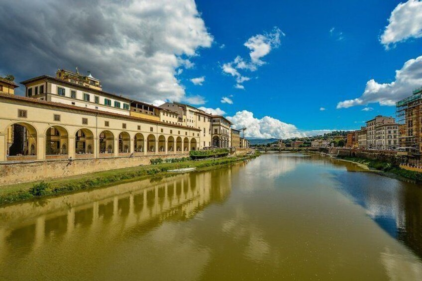 A river with buildings on one side and a clear sky. 5