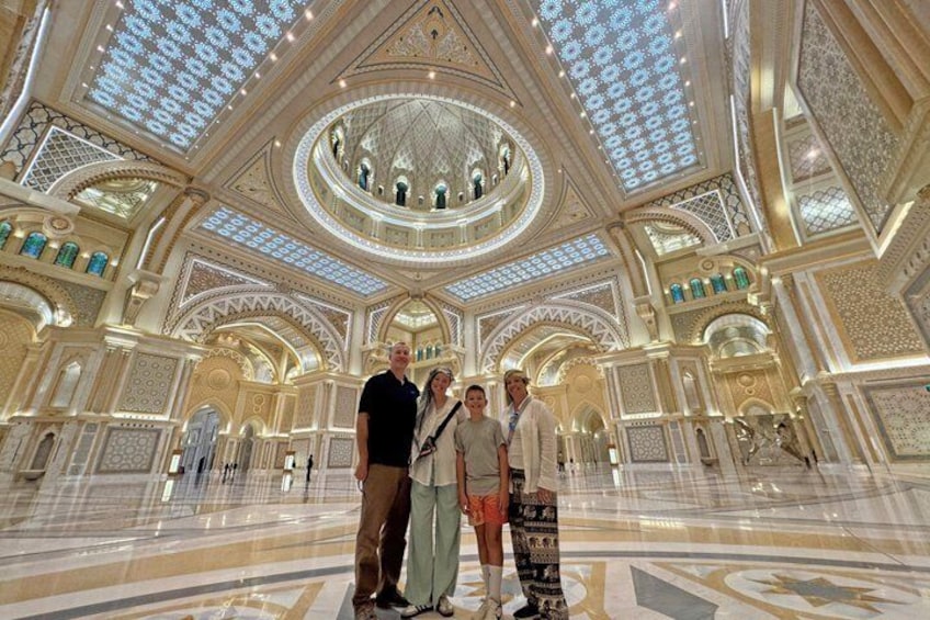 A grand interior with ornate ceilings, a central dome, and a patterned floor. 1