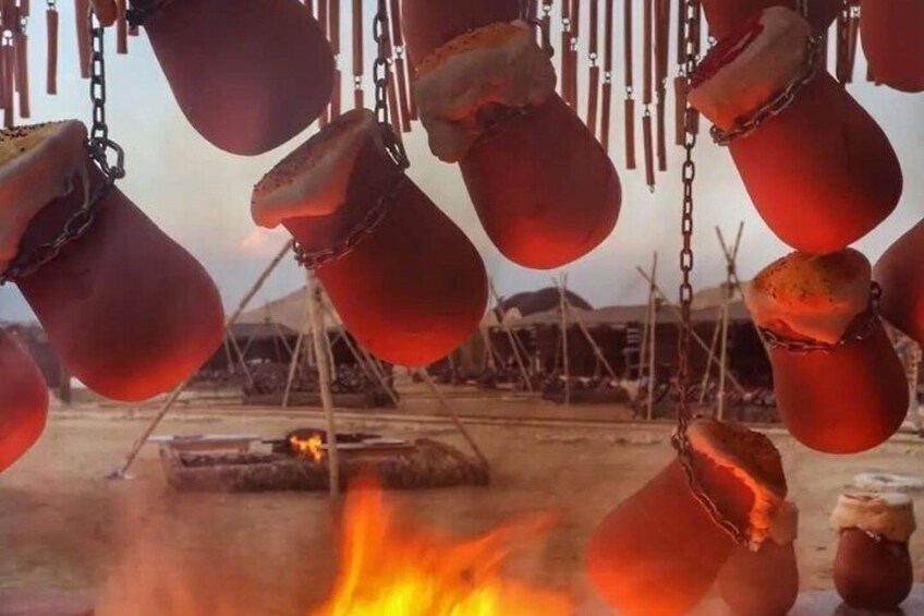 Hanging pots over a fire. 4