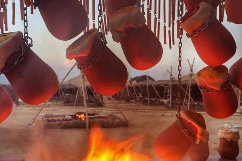 Hanging pots over a fire. 4