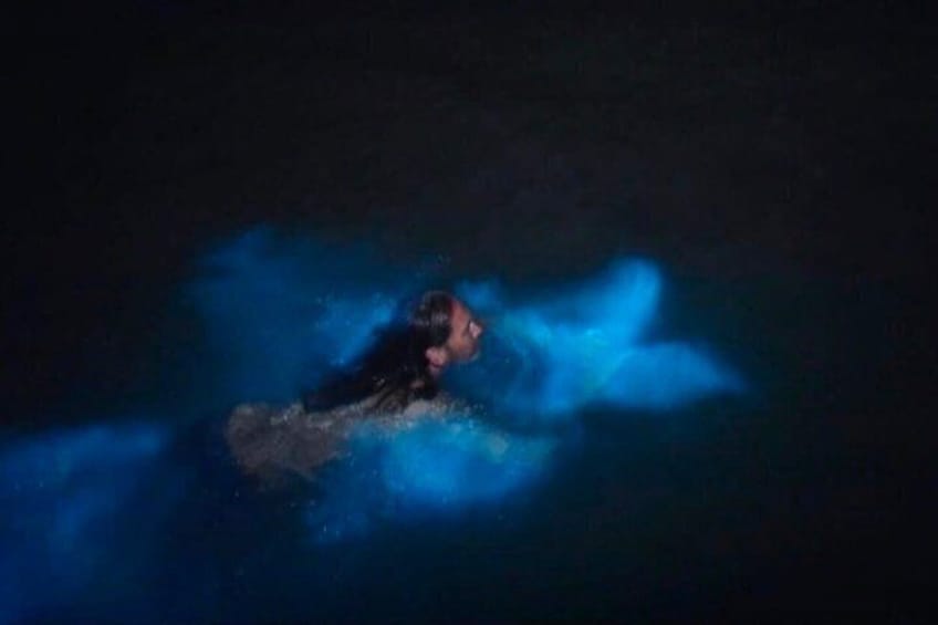 A person surfing in the ocean. 5