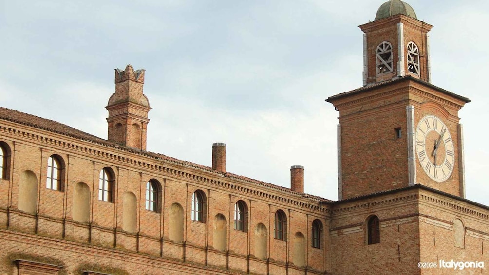A historic building with a clock tower and arched windows. 3