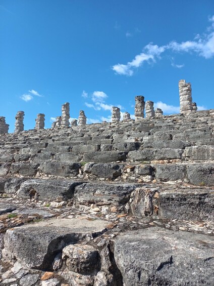 A rocky landscape with ancient stone structures. 2