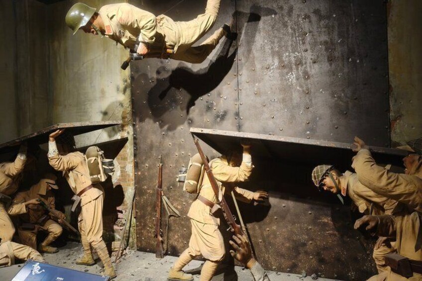 Soldiers in uniform, some climbing a large metal structure, with tools and equipment around them. 5
