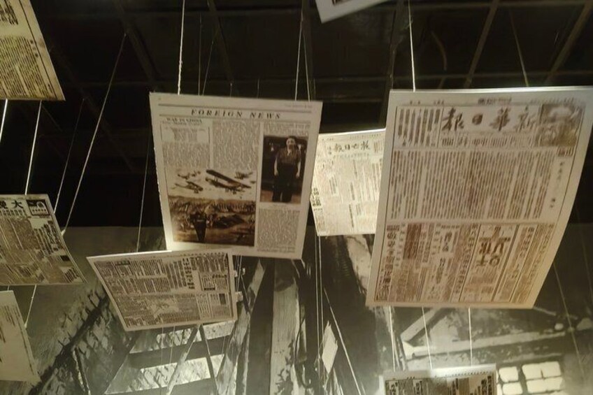 A display of hanging newspapers with text and images. 4
