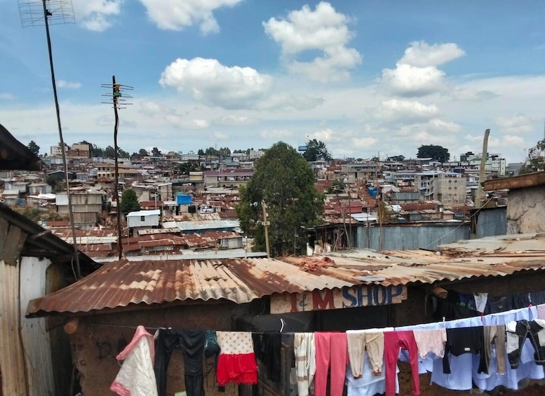 A densely populated urban area with makeshift housing and a visible clothing line. 5