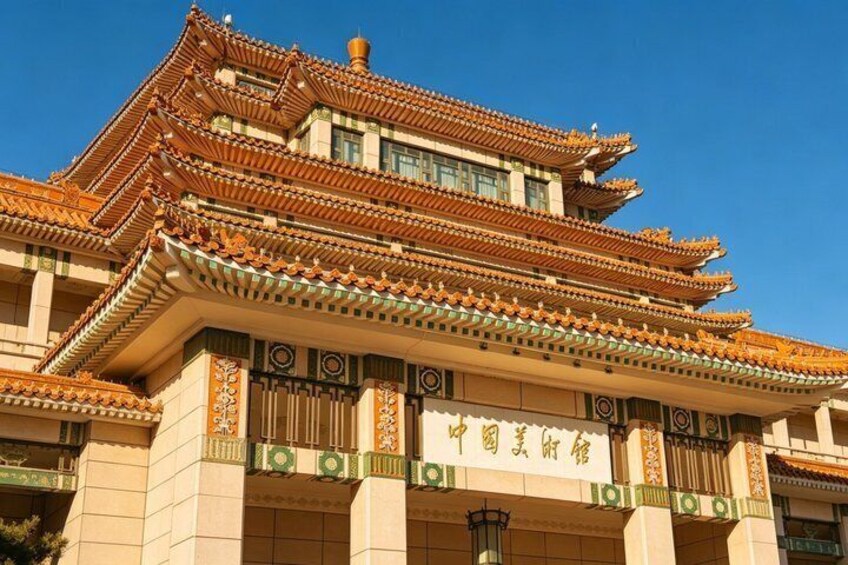 A traditional Chinese building with ornate tiled roofs and detailed architectural carvings. 2