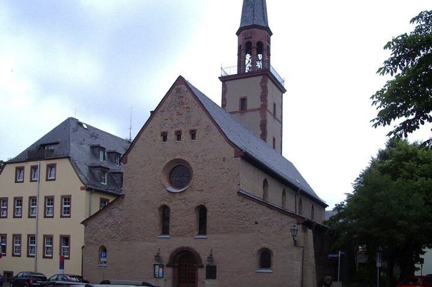 A church with a tall steeple and a clock tower. 2