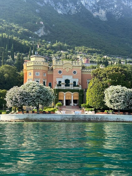 A castle-like building with a water body in front. 2