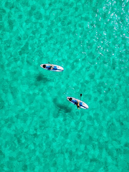 Two paddleboards on turquoise water. 1