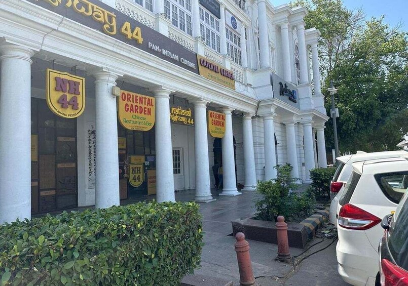 A building with 'Oriental Garden' signs and 'NH 44' on the windows. 1