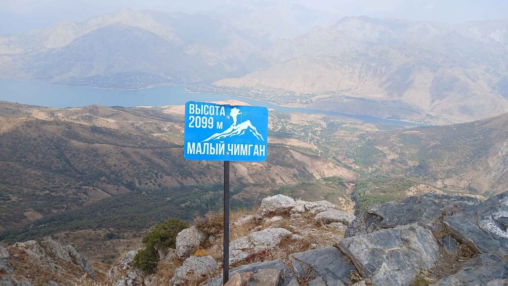 A mountain peak sign with 'BvSOTA 2099 M' and 'MALVI CHIMGHAN' indicating a specific summit. 3