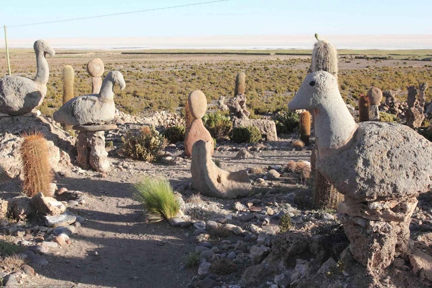 A desert landscape with large rock formations resembling animals. 2