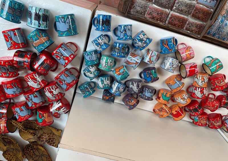 A variety of colorful mugs with animal and abstract designs. 3