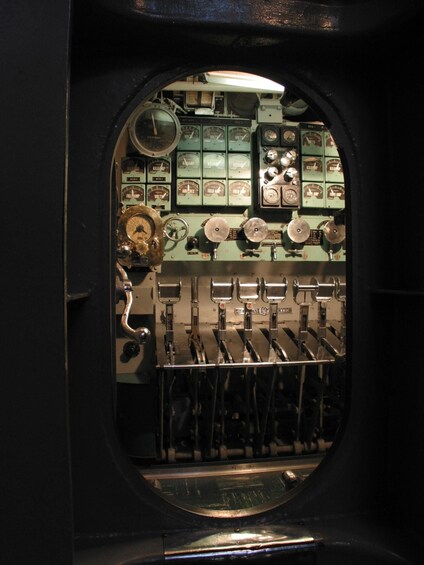 A vintage control panel with gauges and switches, likely from an old vehicle or machinery. 4