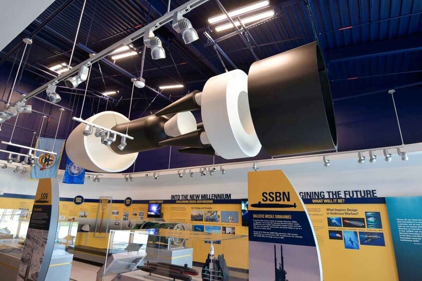 A submarine exhibit with a large model and informational displays. 2
