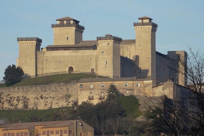A large medieval castle with multiple towers and a fortified wall. 2
