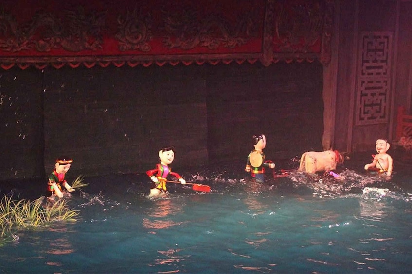 A water show with performers in costumes. 5