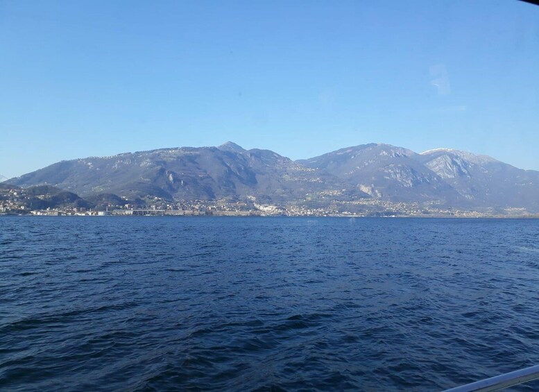 A coastal city with mountains in the background. 4