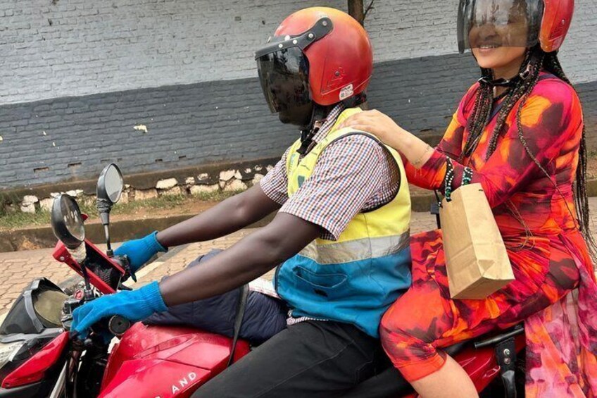 A person on a motorcycle wearing a helmet and a reflective vest. 3