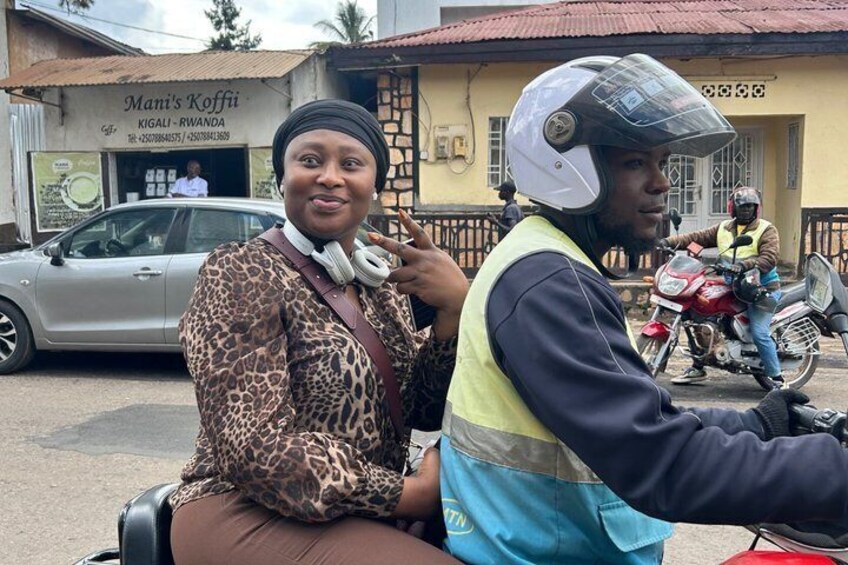 A person in a leopard print top and a motorcycle with a rider in a safety vest. 4