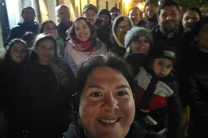 A group of people in a crowded indoor setting. 5