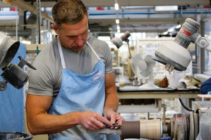 A person working with machinery in an industrial setting. 2